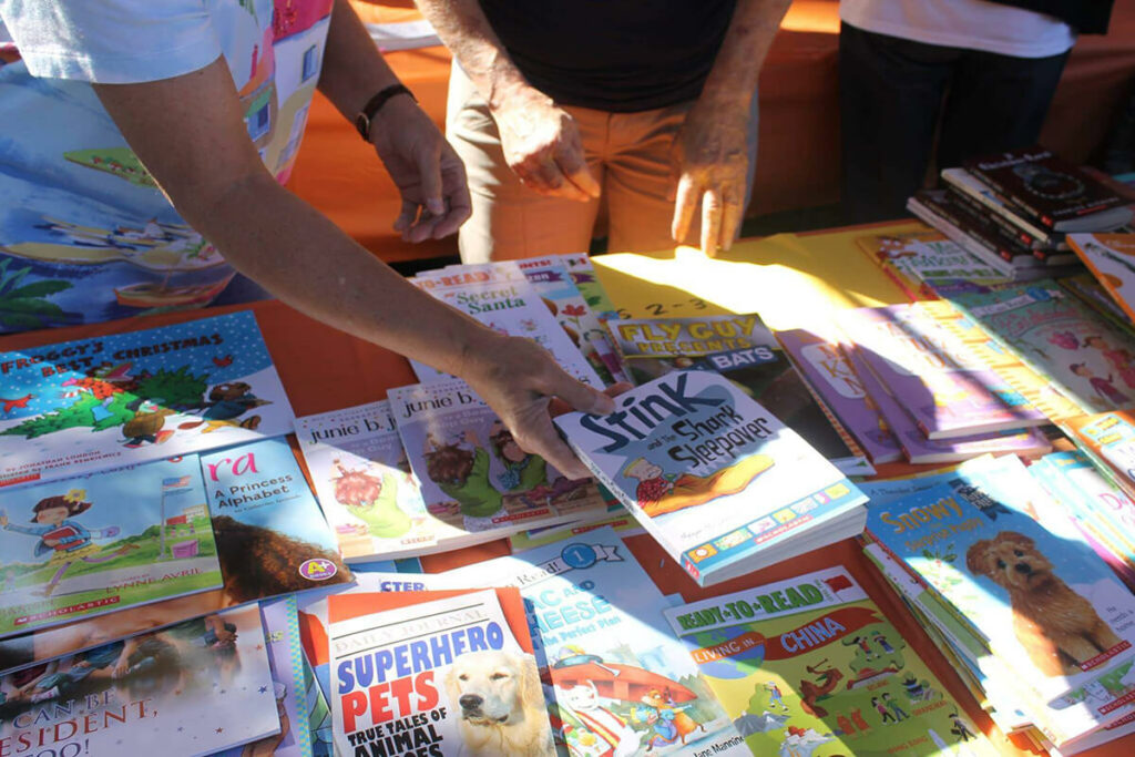 Books being distributed at Family Day at the Park 2016.